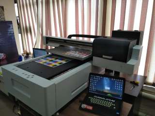 Фото: UV планшетный принтер OPTIMUS 60-90 на трех ТХ800